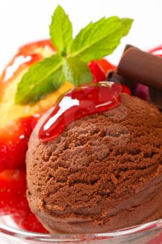 Chocolate ice cream with strawberry sauce