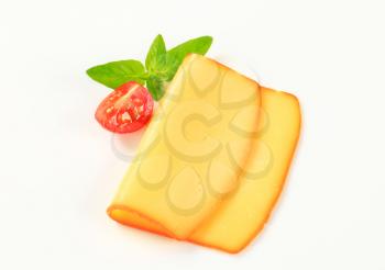 Thin slice of smoked yellow cheese