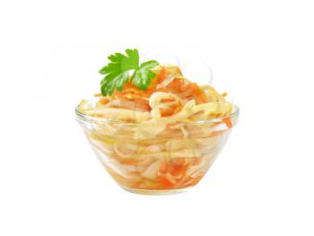 Bowl of pickled cabbage salad isolated on white
