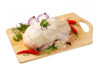 Raw duck and other ingredients on cutting board