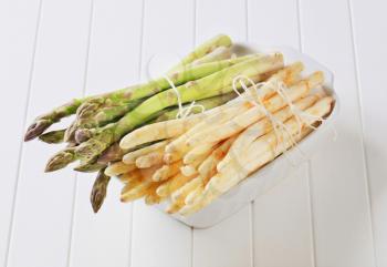 Bundles of fresh white and green asparagus spears