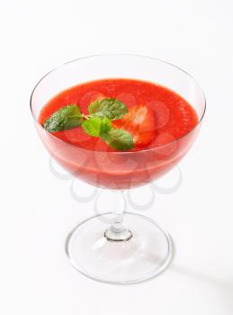 Chilled strawberry puree in stemmed glass