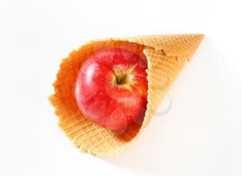 Fresh red apple in waffle cornet 