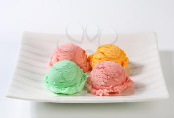 Scoops of ice cream on square plate