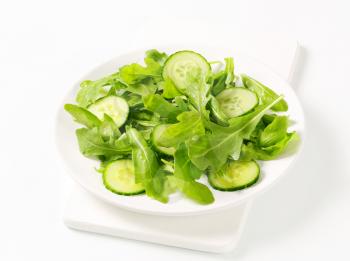 Fresh rocket salad with sliced cucumber