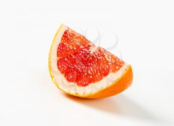 Wedge of fresh red grapefruit