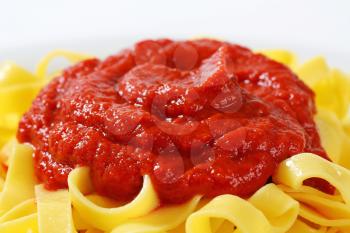 Thin ribbon pasta with tomato puree