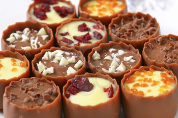 Delicate milk chocolate cups with liqueur and ganache centres