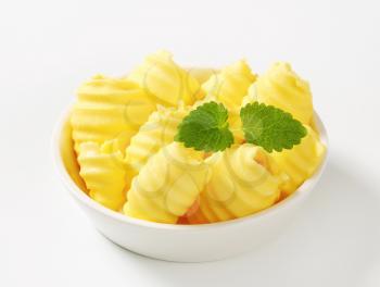 Curls of fresh butter in bowl