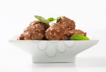 Marzipan nuggets covered with milk chocolate