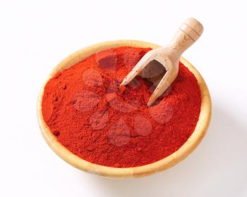 Paprika powder in a wooden bowl