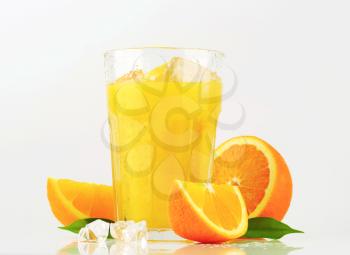 Glass of orange juice with ice