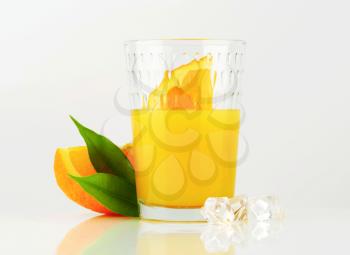 Glass of orange juice with ice