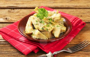 Artichoke hearts dressed in oil and herb marinade