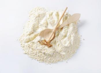 Finely ground flour, wooden beater and spoon