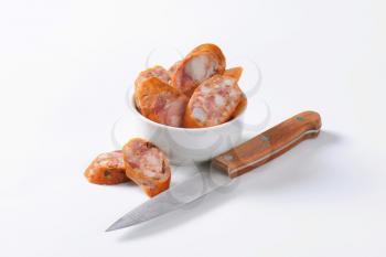 Sliced smoked pork sausage in bowl