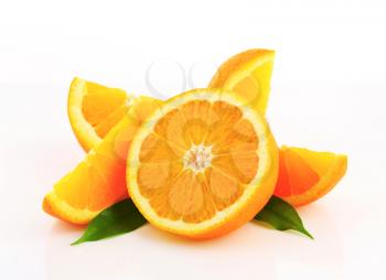 Cut orange fruit - half and wedges