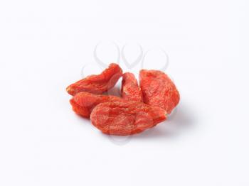 Dried goji berries on white background