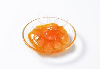 Apricot jam on small glass plate