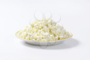 Plate of white crumbly cheese