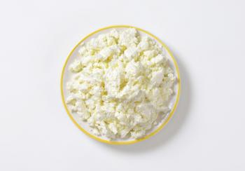 Plate of white crumbly cheese