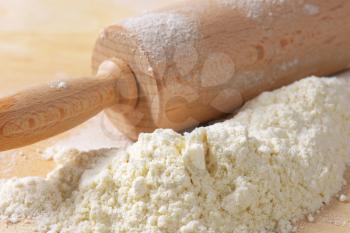 Wheat flour and wooden rolling pin