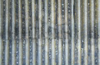 Rusty corrugated metal sheets with rivets
