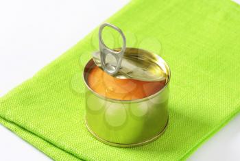 canned pate on folded green cloth