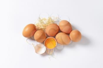 raw eggs on white background