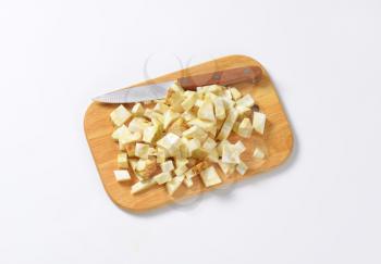 Diced celery root on cutting board