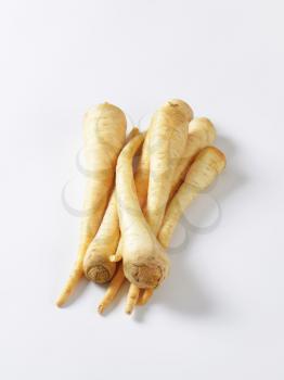 parsley roots on white background