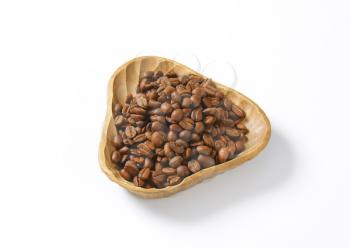 bowl of coffee beans on white background