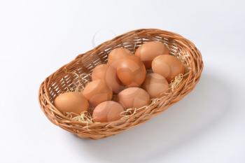 fresh brown eggs in basket