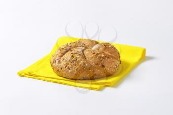 fresh bread bun on yellow place mat