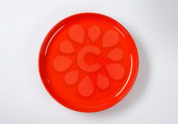 empty round red dinner plate