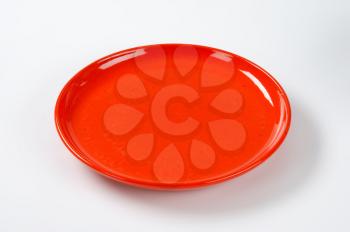 empty round red dinner plate