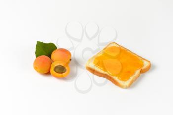 Slice of white bread with apricot jam