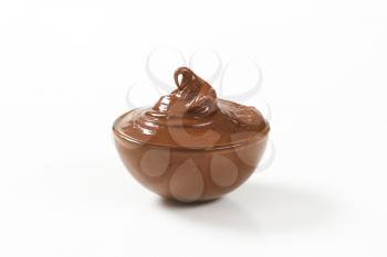 bowl of chocolate spread on white background