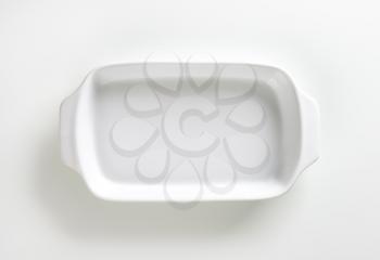 Classic white ceramic baking dish with handles