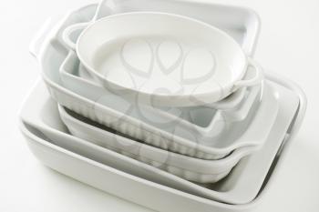 Stacked baking dishes of various sizes and shapes