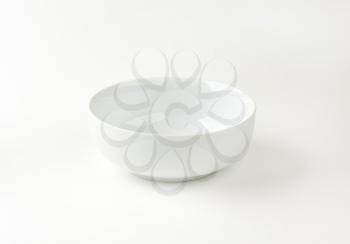 empty wide white bowl on white background