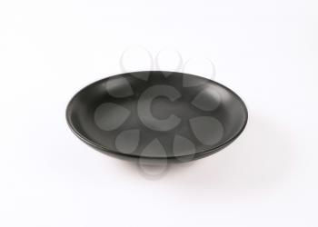 empty black plate on white background