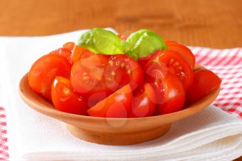 bowl of fresh halved cherry tomatoes