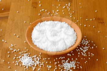 Coarse grained salt in terracotta bowl