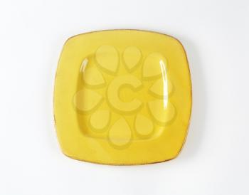 Yellow square plate with wide rim