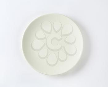 Rimless plain white dinner plate