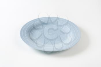 Blue dinner plate with white concentric rings