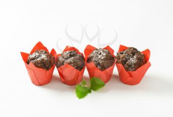 Double chocolate cupcakes wrapped in red paper