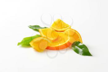 Pieces of fresh orange with leaves