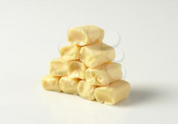 Stack of caramel-like white chewy candies